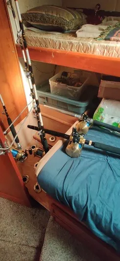 Short People Yacht Photos Pics Fishing rods and gear inside a 1999 Ocean Yachts EXPRESS cabin.