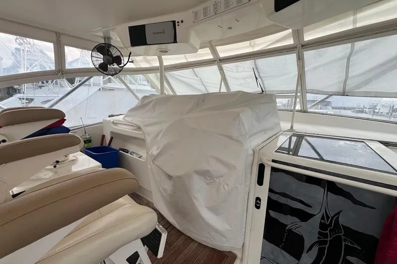 Short People Yacht Photos Pics Interior of 1999 Ocean Yachts EXPRESS SPORTFISH 800 CAT's with covered controls and seating.