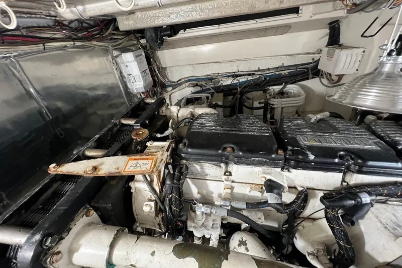 Short People Yacht Photos Pics Engine room of 1999 Ocean Yachts EXPRESS SPORTFISH 800 CAT's, showcasing mechanical components.