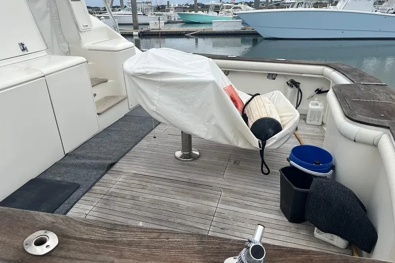 Short People Yacht Photos Pics 1999 Ocean Yachts Sport Fish boat deck with fishing gear and covered seating.