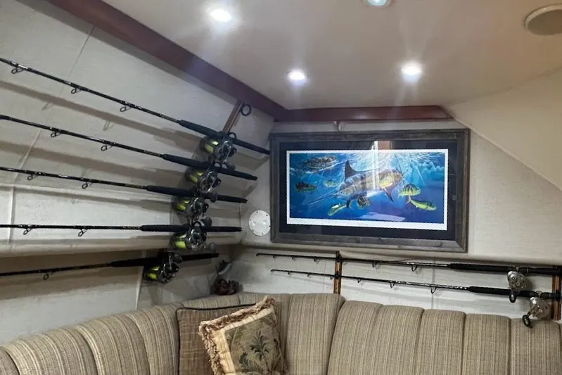 Short People Yacht Photos Pics Interior of 1999 Ocean Yachts Sport Fish with fishing rods and marine artwork.