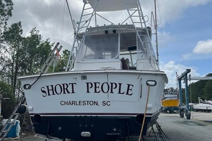 Short People Yacht Photos Pics 1999 Ocean Yachts Sport Fish boat named "Short People" in Charleston, SC, docked outdoors.