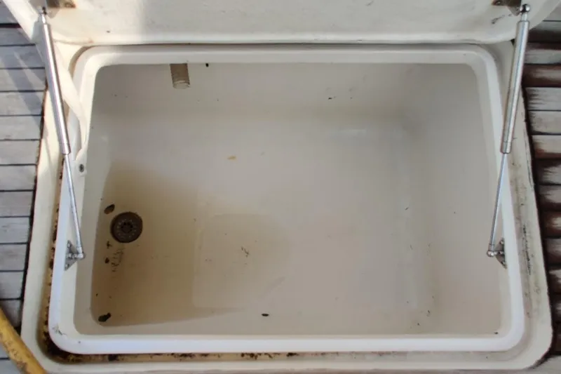 Short People Yacht Photos Pics Open storage compartment on 1999 Ocean Yachts Sport Fish boat deck.