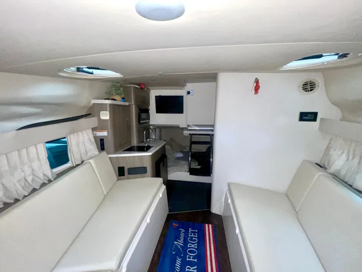  Yacht Photos Pics Interior of 2019 Regal 28 Express boat with seating, kitchenette, and decor.