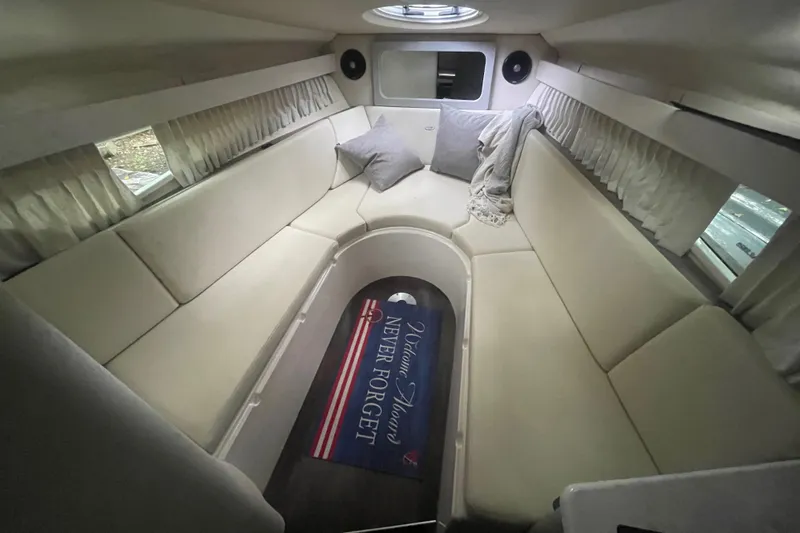  Yacht Photos Pics Interior of 2019 Regal 28 Express boat with cozy seating and decorative rug.