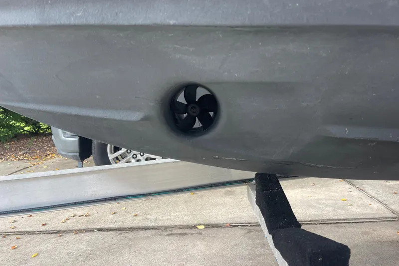  Yacht Photos Pics 2019 Regal 28 Express boat hull with visible thruster on trailer.