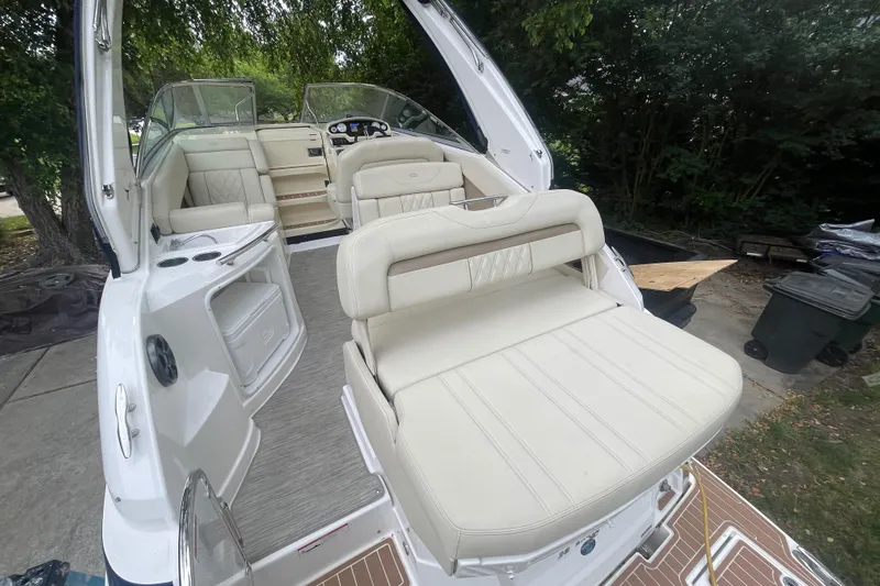  Yacht Photos Pics 2019 Regal 28 Express boat with spacious white seating and modern interior design.