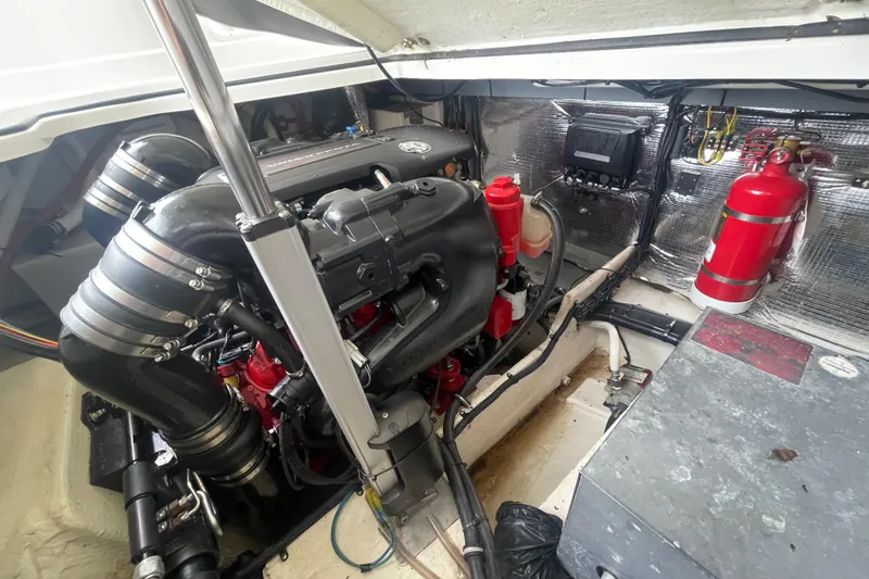  Yacht Photos Pics Engine compartment of a 2019 Regal 28 Express boat, featuring a well-maintained engine.