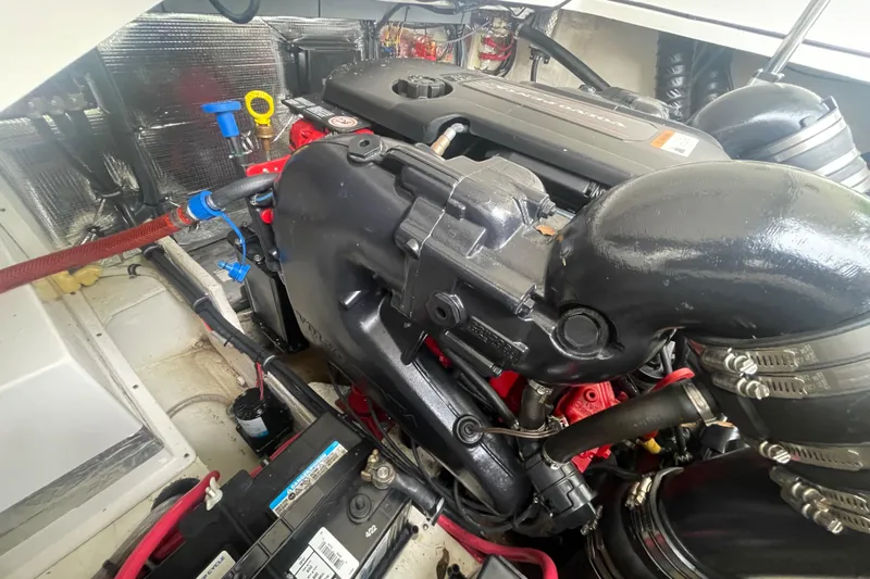  Yacht Photos Pics Engine compartment of a 2019 Regal 28 Express boat, showcasing detailed components.
