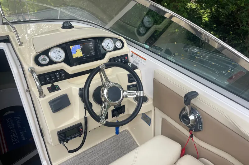  Yacht Photos Pics 2019 Regal 28 Express boat cockpit with steering wheel and navigation controls.