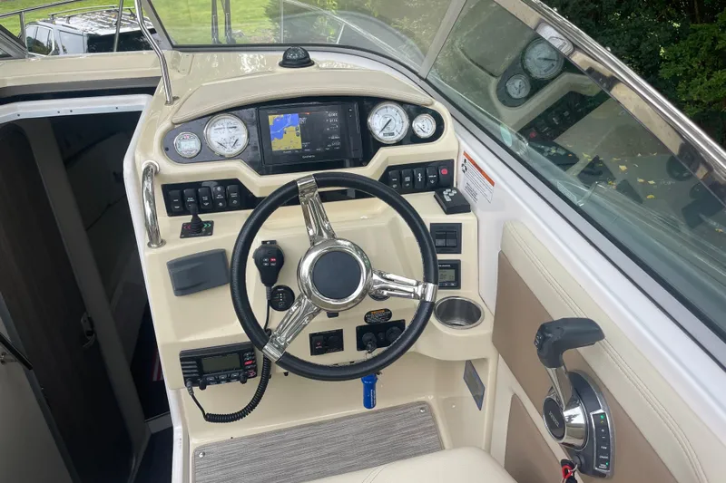  Yacht Photos Pics 2019 Regal 28 Express boat dashboard with steering wheel and navigation controls.