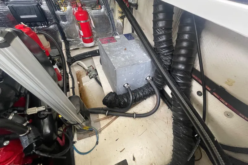  Yacht Photos Pics Engine compartment of a 2019 Regal 28 Express boat with fire extinguisher and ventilation hoses.