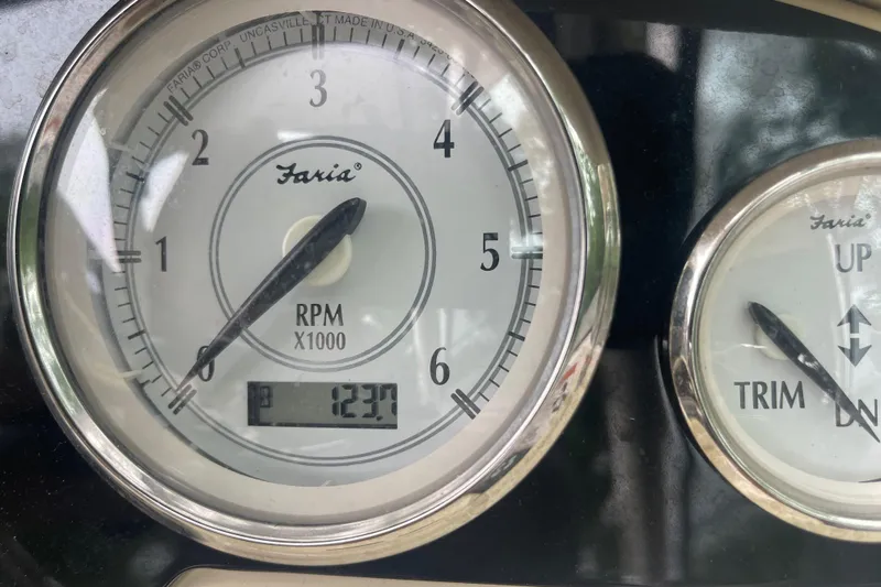  Yacht Photos Pics Close-up of 2019 Regal 28 Express boat tachometer and trim gauge.