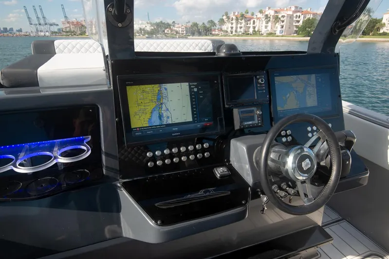  Yacht Photos Pics 2025 Sardine Marine Custom Race 55 boat cockpit with navigation screens and steering wheel.