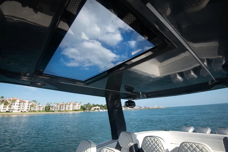  Yacht Photos Pics Interior view of 2025 Sardine Marine Custom Race 55 boat with ocean and sky through sunroof.