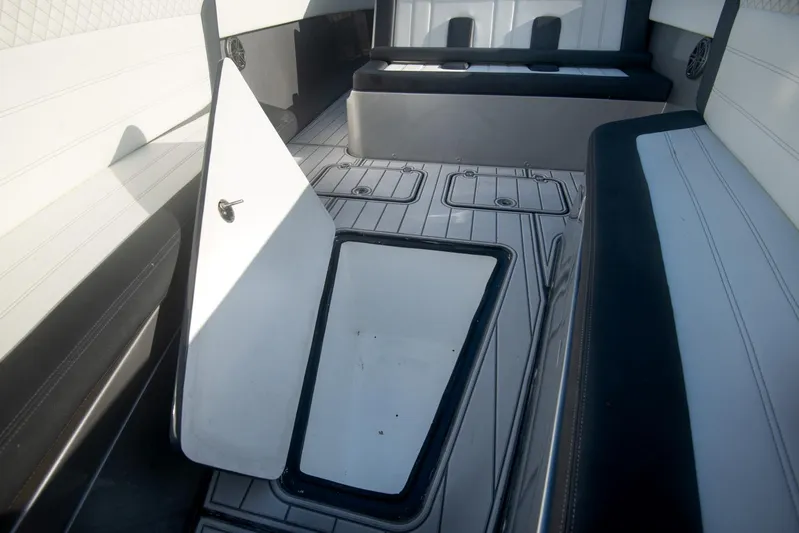  Yacht Photos Pics 2025 Sardine Marine Custom Race 55 interior with open storage compartment.