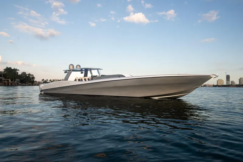  Yacht Photos Pics Sleek 2025 Sardine Marine Custom Race 55 boat on calm water under blue sky.