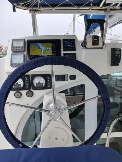 Double Diamond Yacht Photos Pics Steering wheel and navigation controls of a 2007 Lagoon 380 S2 catamaran.
