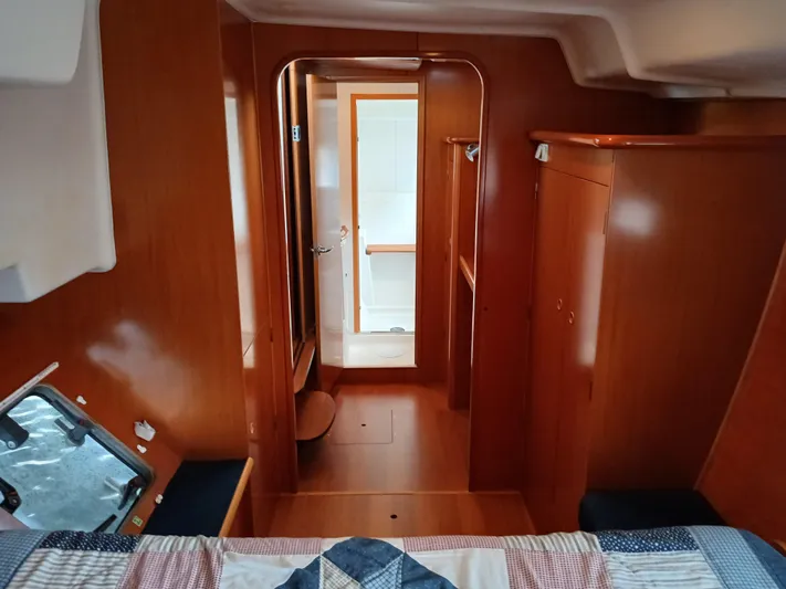 Double Diamond Yacht Photos Pics Interior of 2007 Lagoon 380 S2 yacht cabin with wood finish and cozy layout.