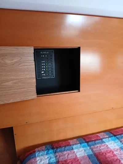 Double Diamond Yacht Photos Pics Wooden interior panel with an open compartment on a 2007 Lagoon 380 S2 yacht.