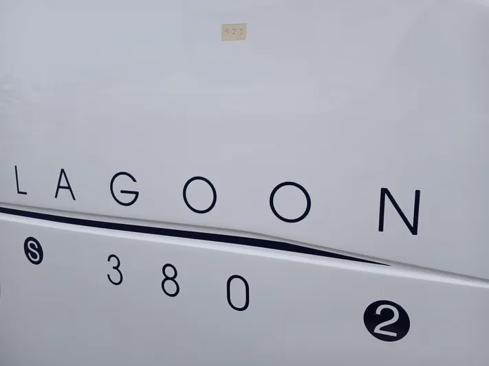 Double Diamond Yacht Photos Pics Lagoon 380 S2 catamaran, 2007 model, white hull with black lettering.