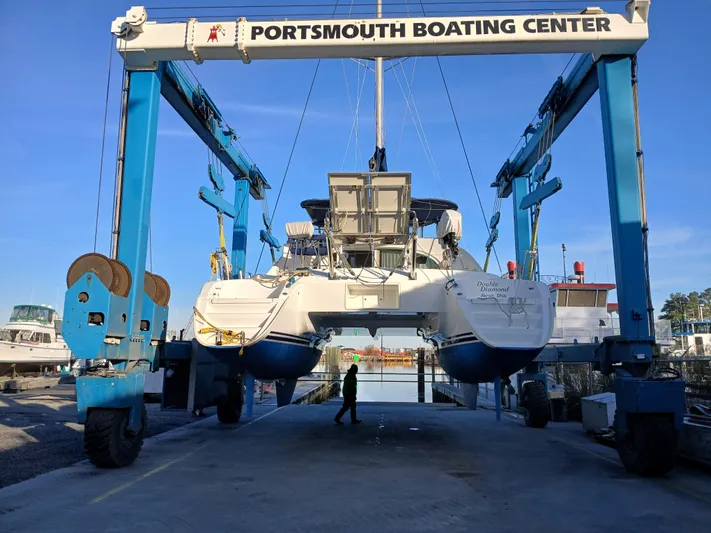 Double Diamond Yacht Photos Pics Lagoon 380 S2 catamaran from 2007 at Portsmouth Boating Center lift.