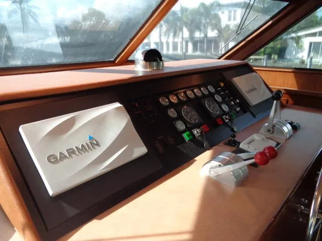 Hatty Shack Yacht Photos Pics Hatteras 67 Cockpit Motor Yacht 1989 helm with Garmin navigation system and control panel.