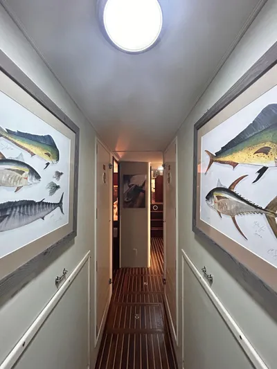 Hatty Shack Yacht Photos Pics Hallway of 1989 Hatteras 67 Cockpit Motor Yacht with fish artwork.
