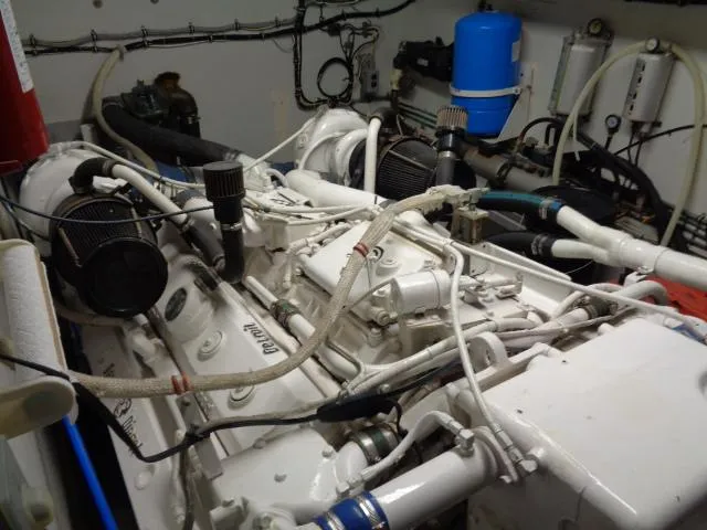 Hatty Shack Yacht Photos Pics Engine room of 1989 Hatteras 67 Cockpit Motor Yacht with visible machinery and components.