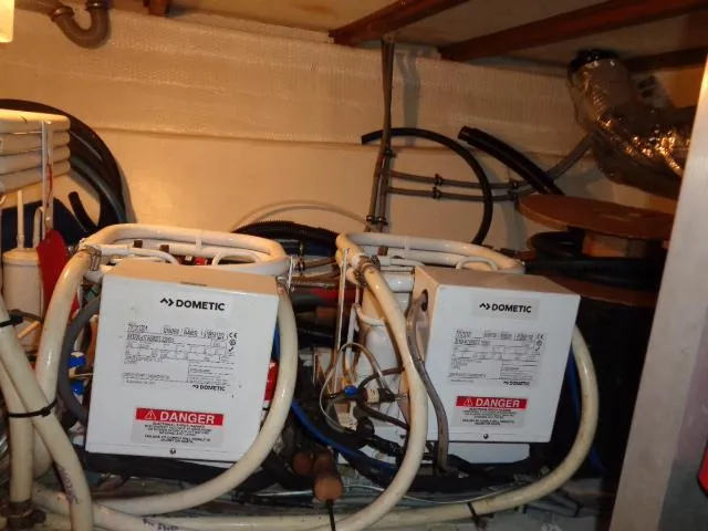 Hatty Shack Yacht Photos Pics Engine room of 1989 Hatteras 67 Cockpit Motor Yacht with Dometic equipment.