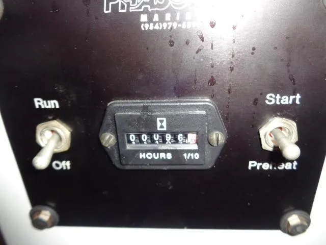 Hatty Shack Yacht Photos Pics Control panel of 1989 Hatteras 67 Cockpit Motor Yacht with hour meter and switches.