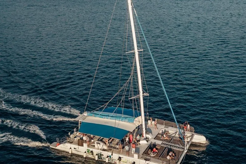 Tahiti Yacht Photos Pics 2015 Fountaine Pajot TAHITI catamaran sailing on open water with passengers onboard.