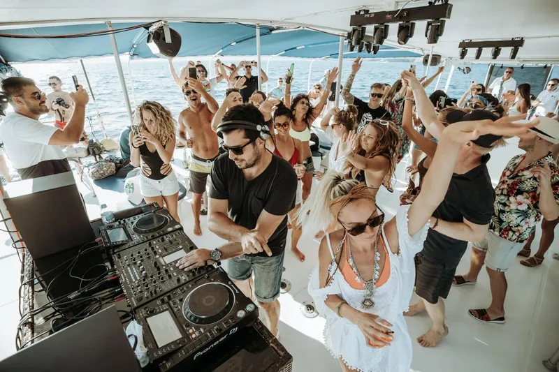 Tahiti Yacht Photos Pics Party on Fountaine Pajot TAHITI 2015 catamaran with DJ and dancing crowd.