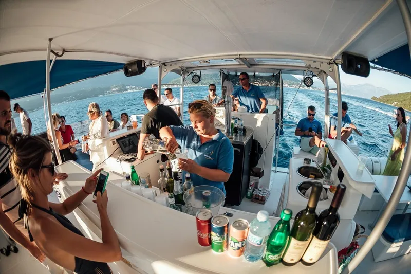 Tahiti Yacht Photos Pics People enjoying drinks on a 2015 Fountaine Pajot TAHITI catamaran cruise.