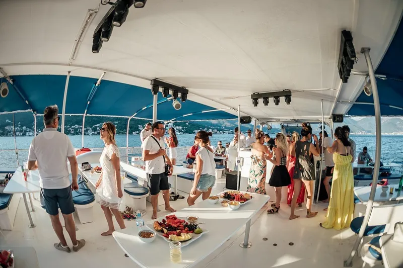 Tahiti Yacht Photos Pics People enjoying a party on a 2015 Fountaine Pajot TAHITI catamaran, with scenic ocean views.