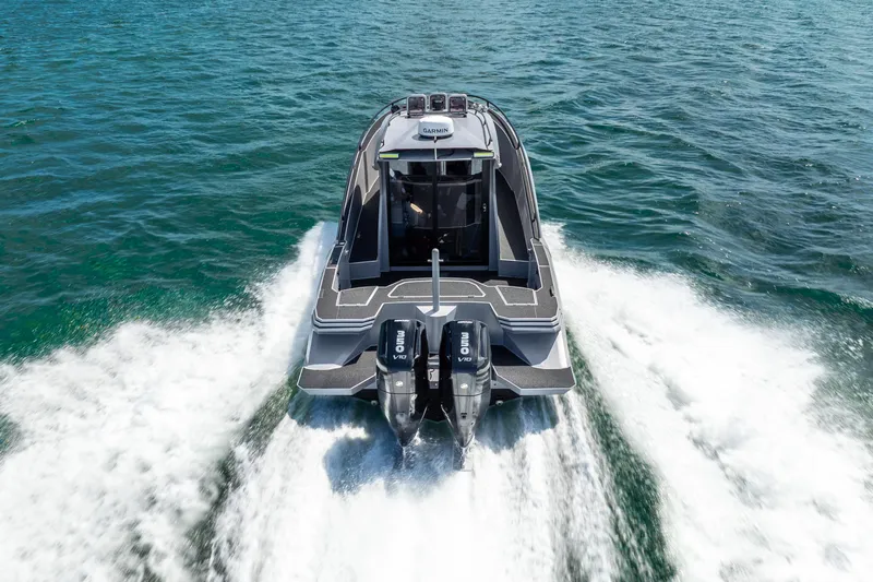  Yacht Photos Pics 2025 Novielli SERE boat cruising on open water, rear view.