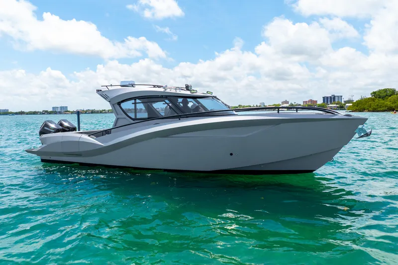  Yacht Photos Pics 2025 Novielli SERE boat on clear blue water under a partly cloudy sky.
