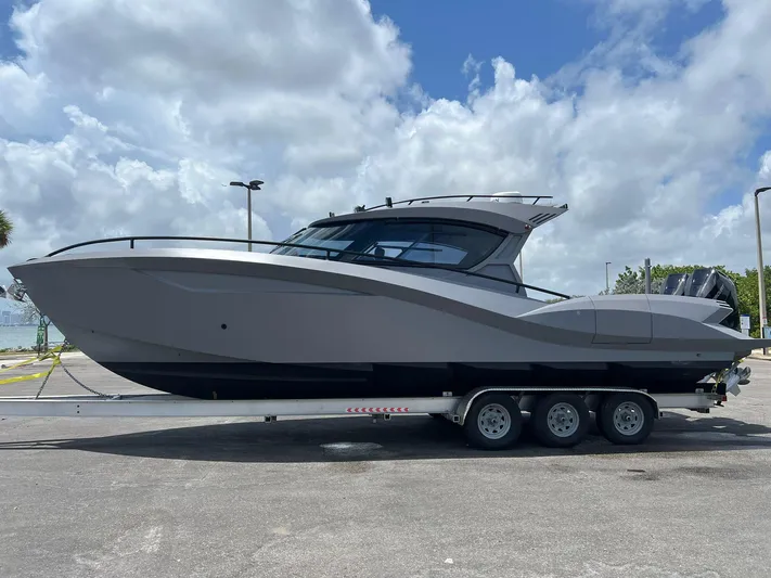  Yacht Photos Pics 2025 Novielli SERE boat on trailer under cloudy sky.