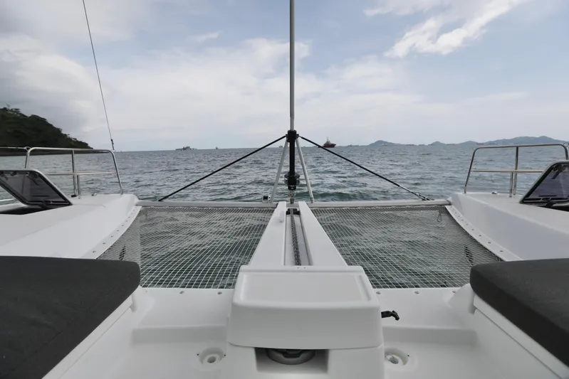 Babur Yacht Photos Pics Front deck of 2021 Lagoon 46 catamaran sailing on open sea.