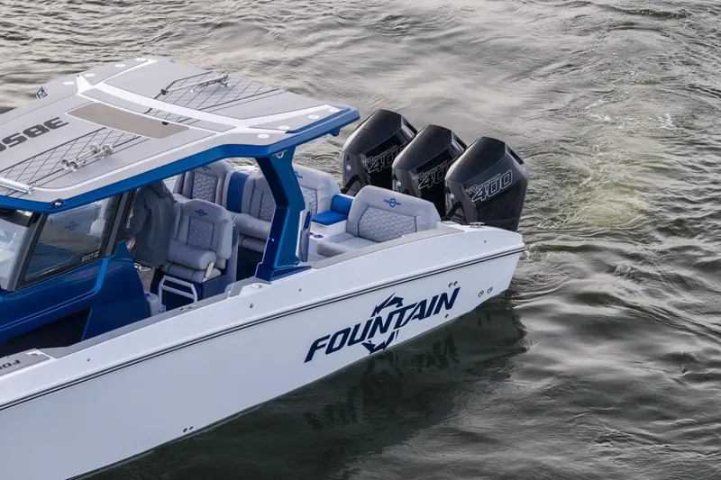  Yacht Photos Pics 2026 Fountain 38 SCX boat with triple outboard engines on water.