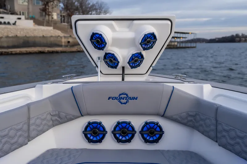 Yacht Photos Pics 2026 Fountain 38 SCX boat with blue speakers and luxurious seating on the water.