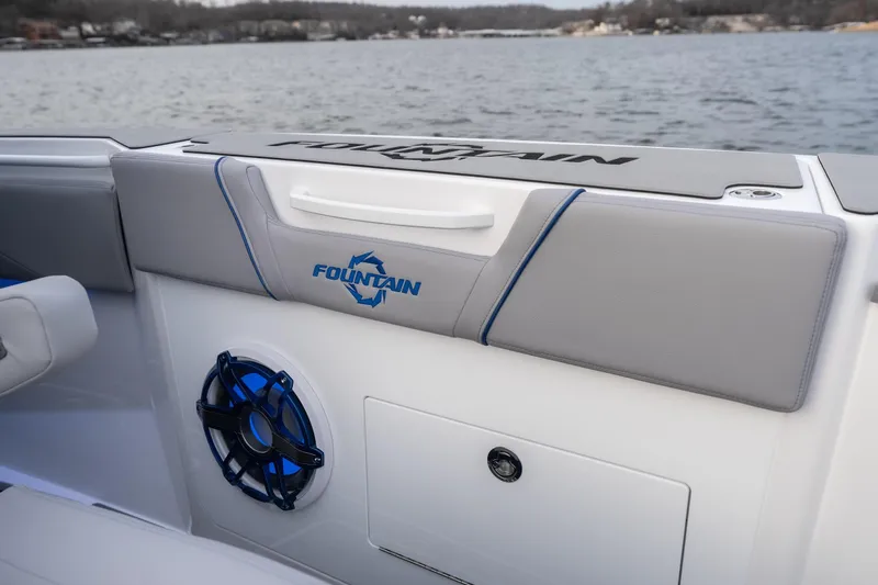  Yacht Photos Pics 2026 Fountain 38 SCX boat interior with speaker and logo, on a scenic lake.