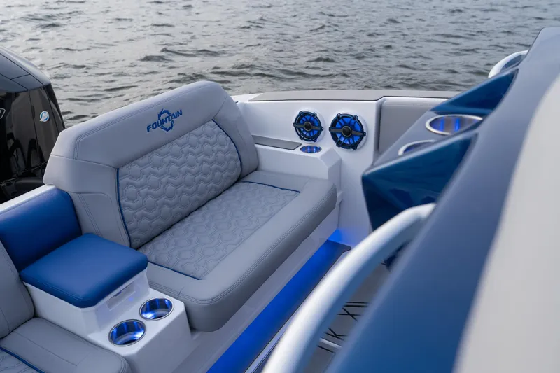  Yacht Photos Pics 2026 Fountain 38 SCX boat interior with plush seating and blue LED lighting.