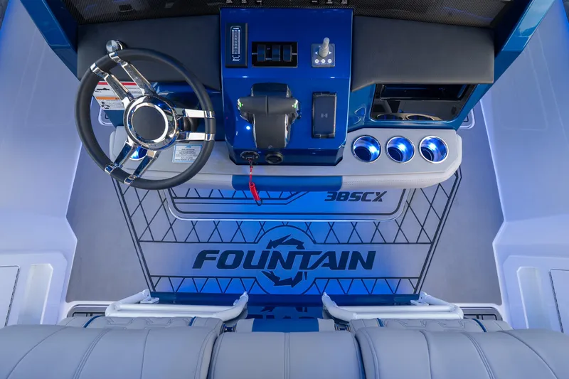  Yacht Photos Pics 2026 Fountain 38 SCX boat cockpit with modern steering and controls.