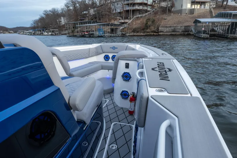  Yacht Photos Pics 2026 Fountain 38 SCX boat interior with seating, speakers, and water view.