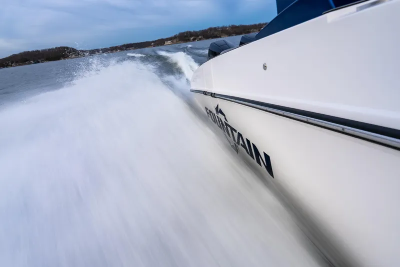  Yacht Photos Pics 2026 Fountain 38 SCX speedboat slicing through water at high speed.