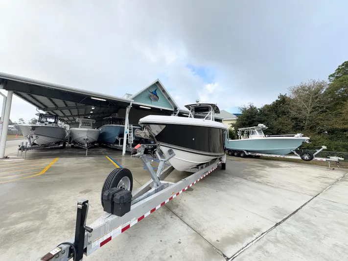  Yacht Photos Pics 2018 Fountain 34 CC boat on trailer in marina storage area.