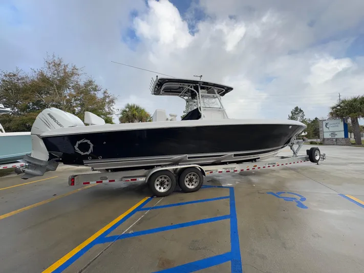  Yacht Photos Pics 2018 Fountain 34 CC boat on trailer in parking lot.