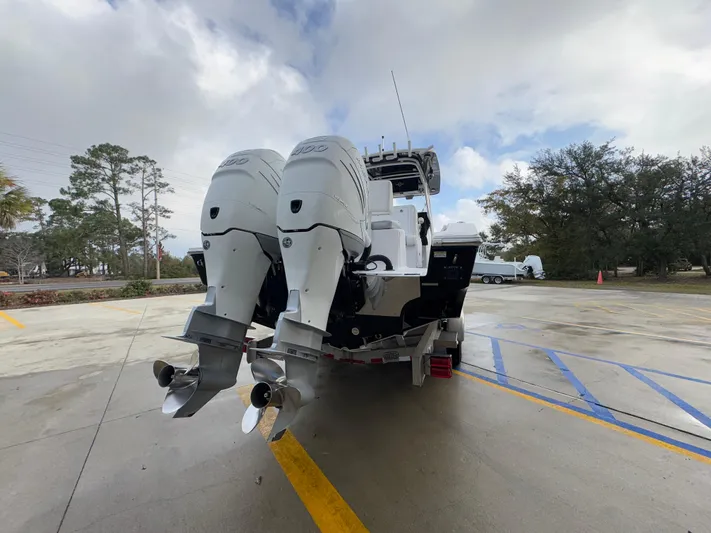  Yacht Photos Pics 2018 Fountain 34 CC boat with dual outboard motors on a trailer.