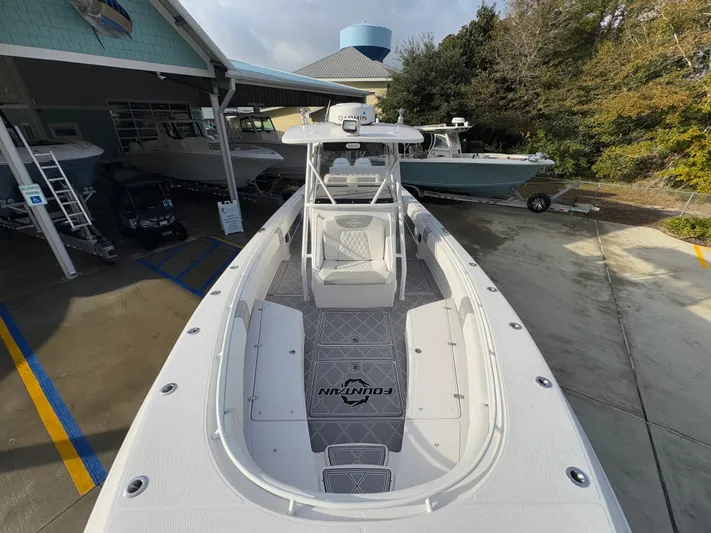  Yacht Photos Pics 2018 Fountain 34 CC boat docked at marina, top view.